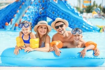 Young family in the water at a water park.