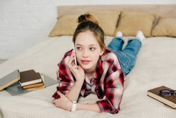 Young teen talking on the phone.