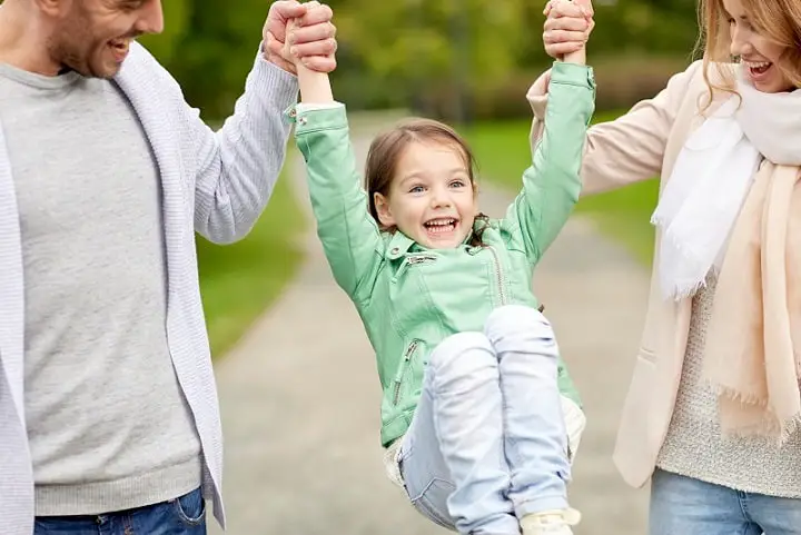 happy family walking in summer park and having fun